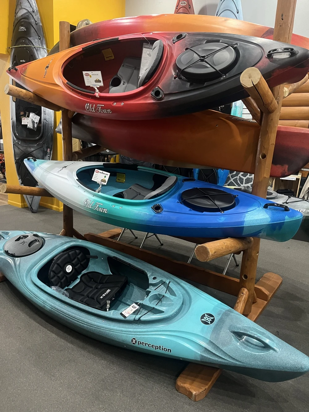Kayaks on a display rack in the Adventure Outfitters shop