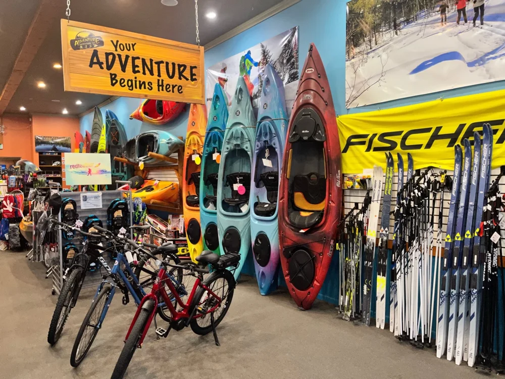 Bicycles and outdoor equipment inside the Adventure Outfitters store